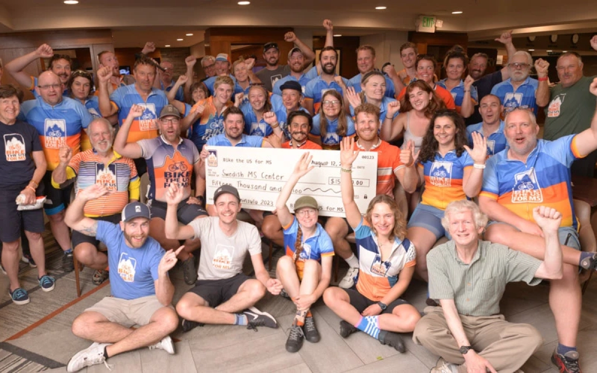 Bike the US for MS making donations to MS clinics during their MS bike rides.