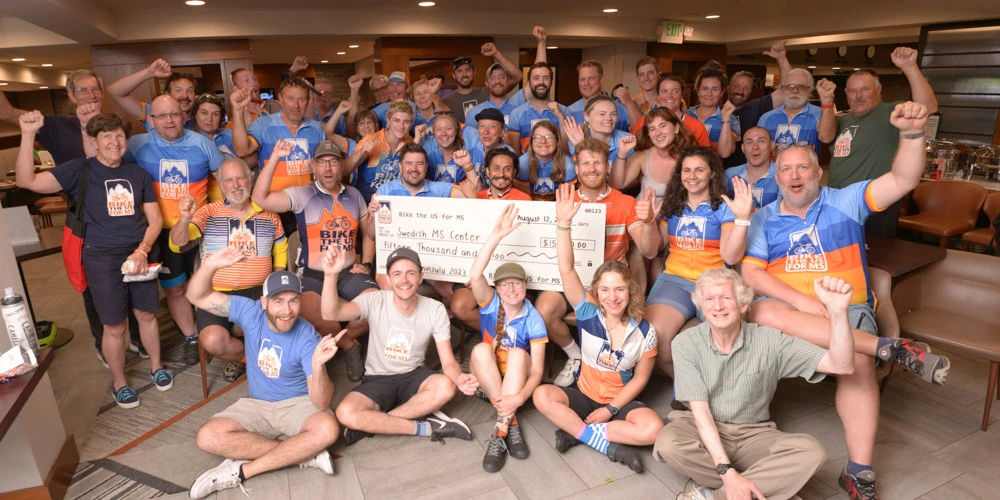 Bike the US for MS making donations to MS clinics during their MS bike rides.