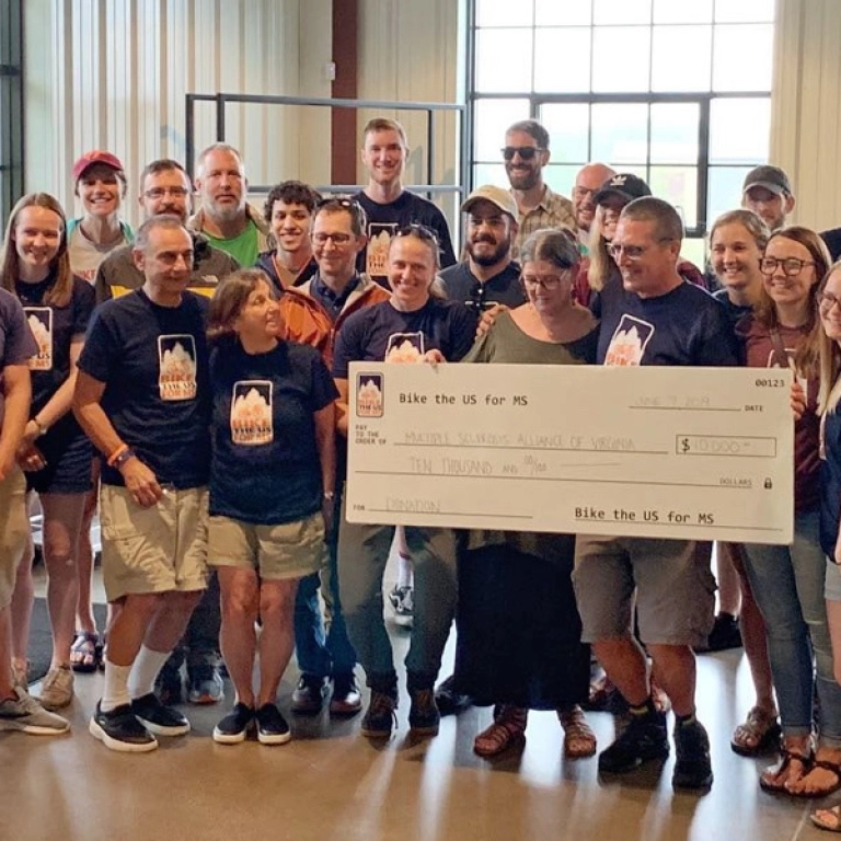 Bike the US for MS check donation with MSAV for multiple sclerosis support.