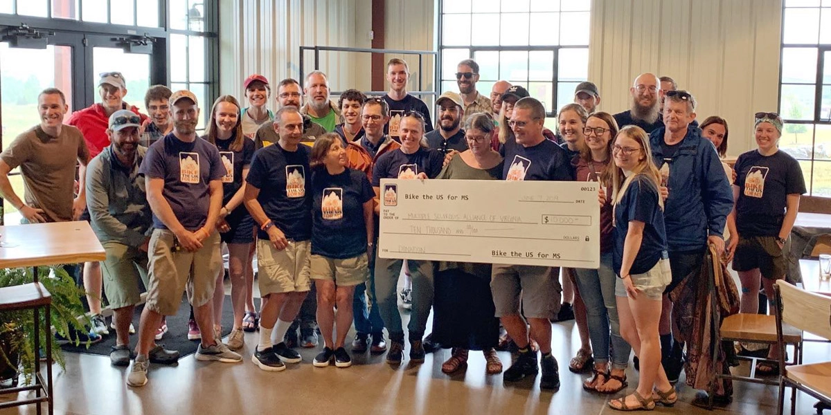 Bike the US for MS check donation with MSAV for multiple sclerosis support.