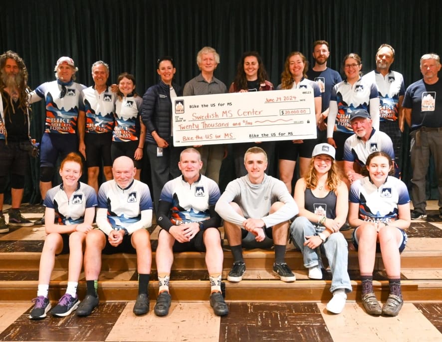 Bike the US for MS team with check