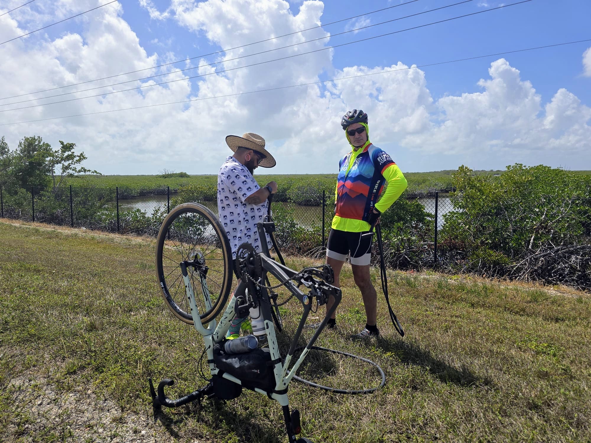 Big skies, open road, and another stop to deal with another flat.